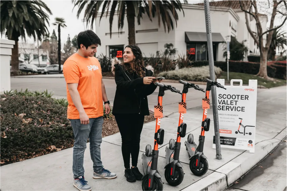 Women using the Spin Scooter valet service